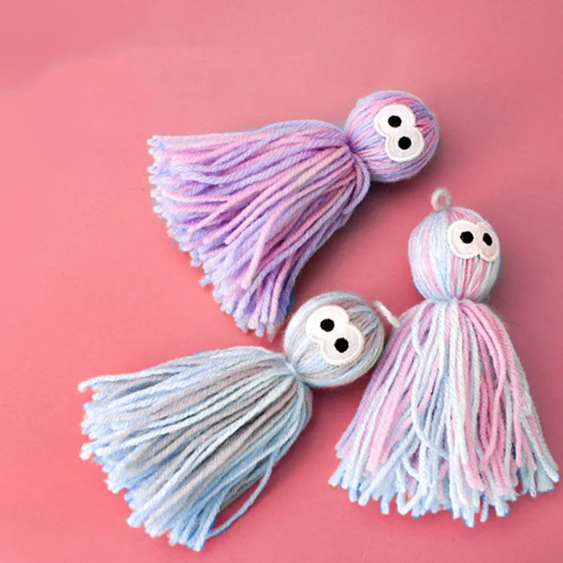 Wool cat ball toy with teaser stick attachment in blue-grey colour variation
