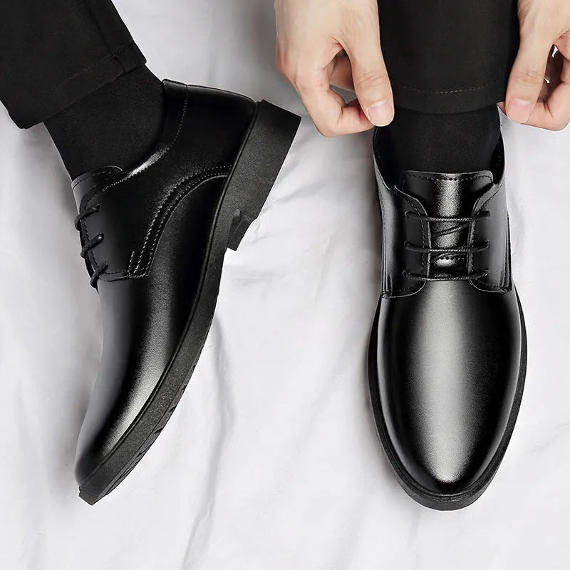 Men's black round toe pointed cap low top PU formal shoes with stitched detailing on white background