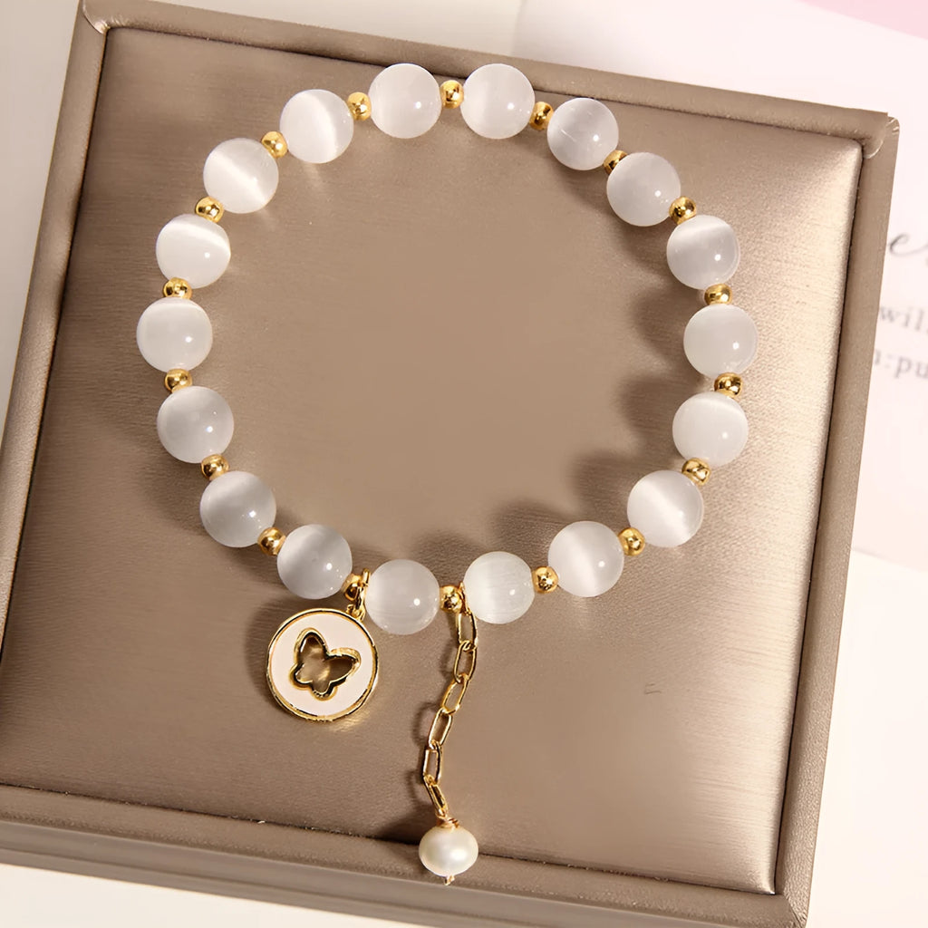 Handmade white cat's eye crystal bracelet with geometric Korean-style design.