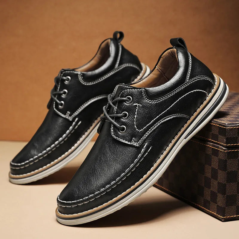 Men's black genuine leather casual lace-up shoes with round toe and low heel on a rubber sole.