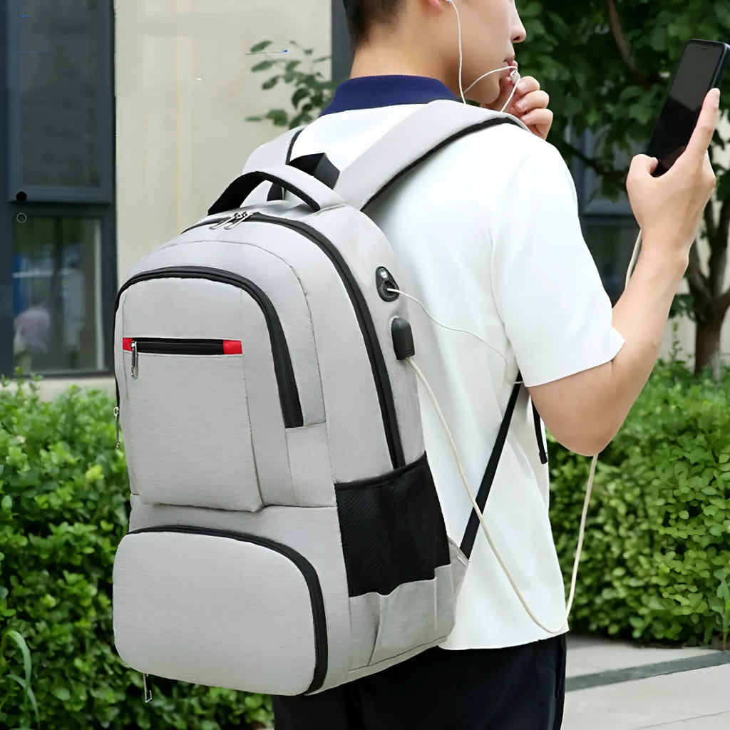 Light grey insulated Oxford cloth backpack with curved shoulder straps and dry wet separation compartments