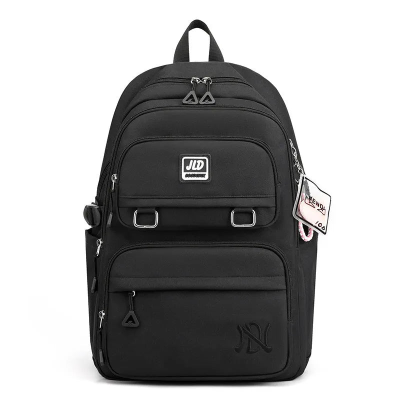 Girls' large nylon backpack in a solid colour showing curved back panel and front pocket.
