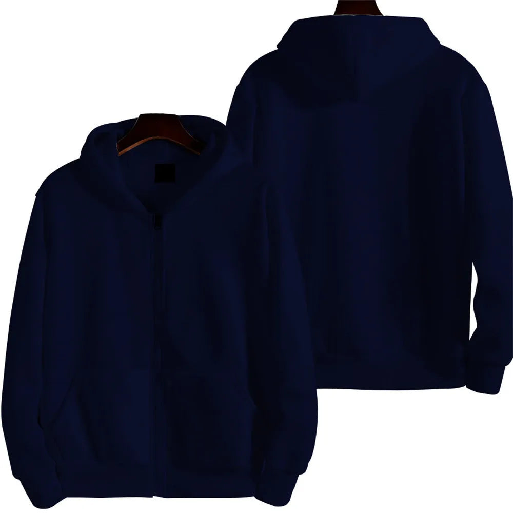 Man wearing a solid colour loose fit zip-up sports jacket in a casual setting.