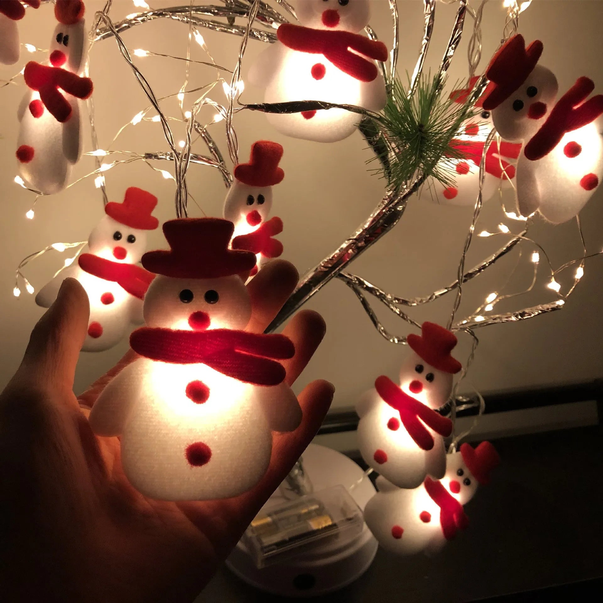 Christmas snowman LED string lights garland with warm white bulbs and character decorations