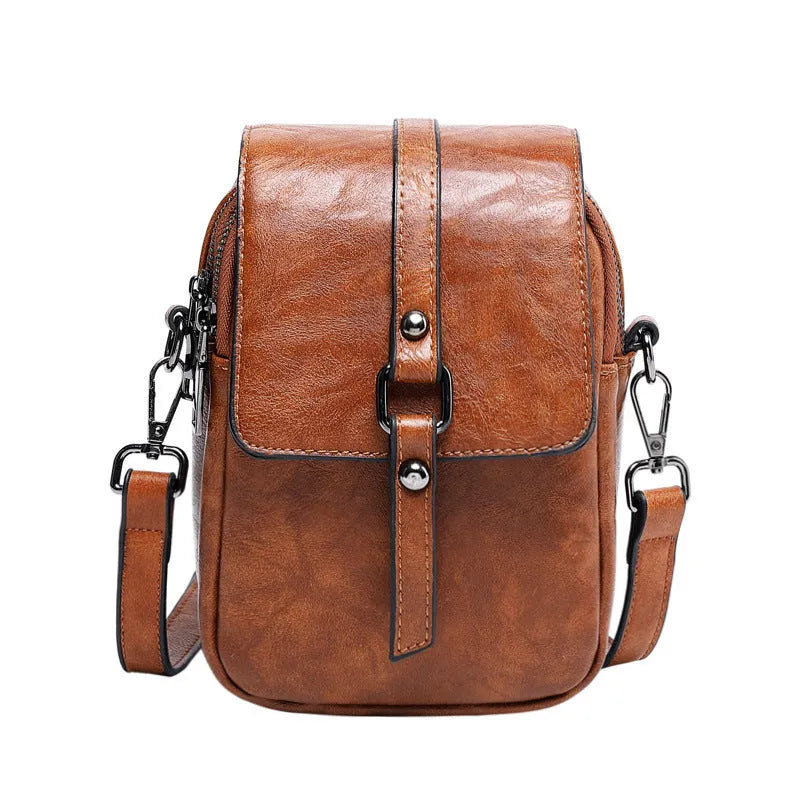 Women's retro crossbody phone bag in brown PU with square clamshell shape and single shoulder strap