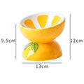 Ceramic elevated cat bowl with tilted wide dish in orange pattern for reduced vomiting feeding
