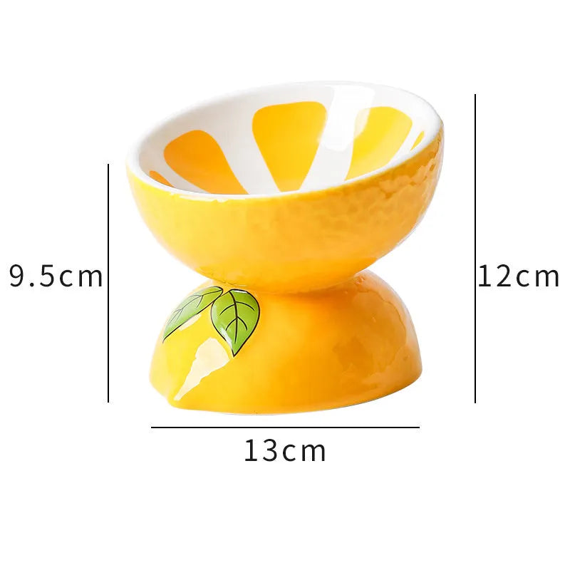 Ceramic elevated cat bowl with tilted wide dish in orange pattern for reduced vomiting feeding