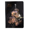 A5 hardback notebook with luminous cover open to show colour illustrated pages.
