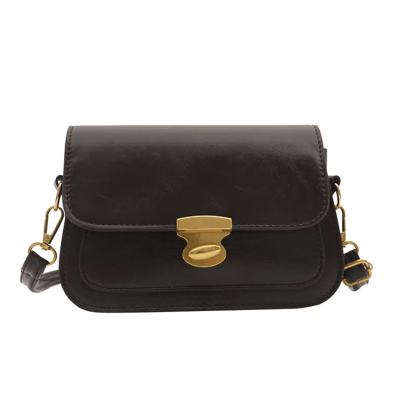 Small retro square shoulder bag in soft PU leather showing horizontal rectangular shape