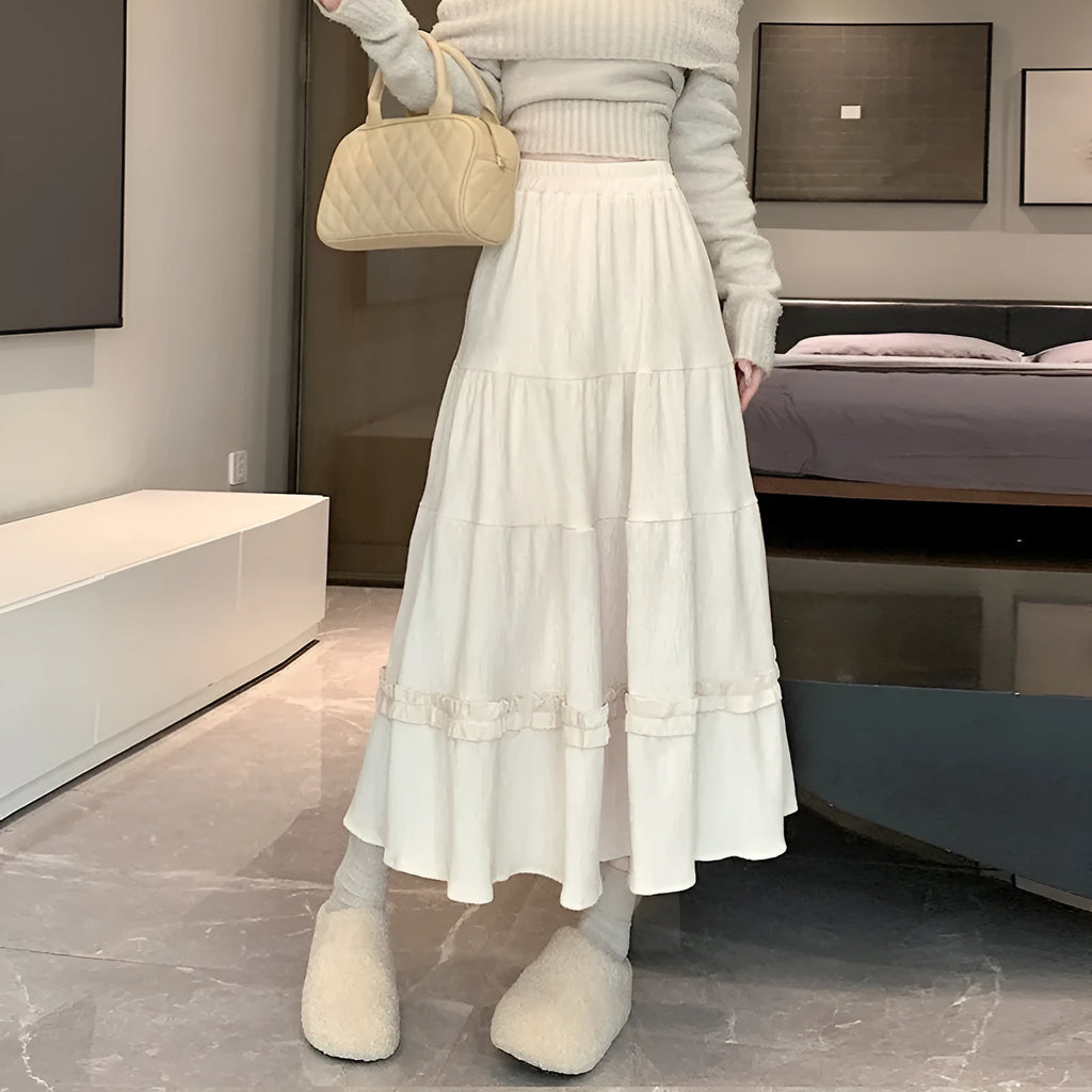 Women's solid colour corduroy A-line midi skirt with elastic waistband in milky white.