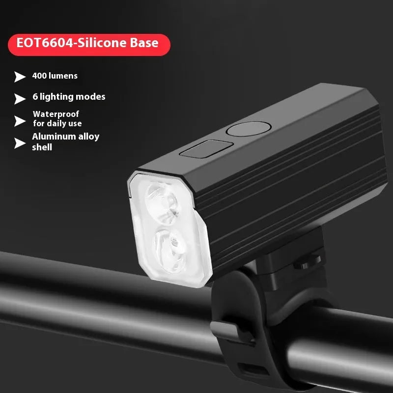Aluminium alloy bicycle headlight with silicone mount on handlebars showing 400 lumen output