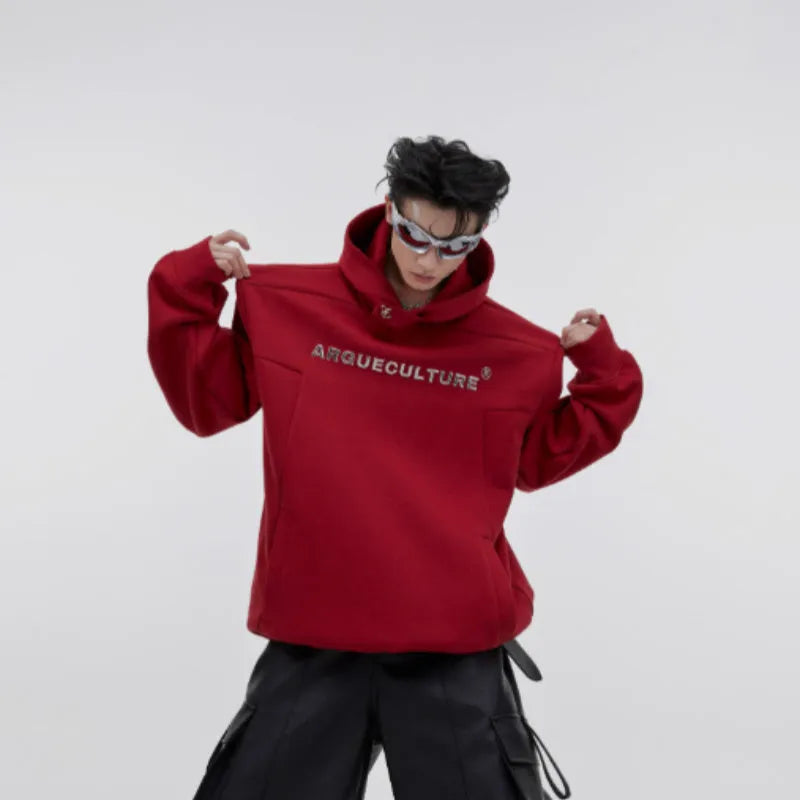 Men's red loose hooded sweater with 3D metal printing and structured shoulder pads.