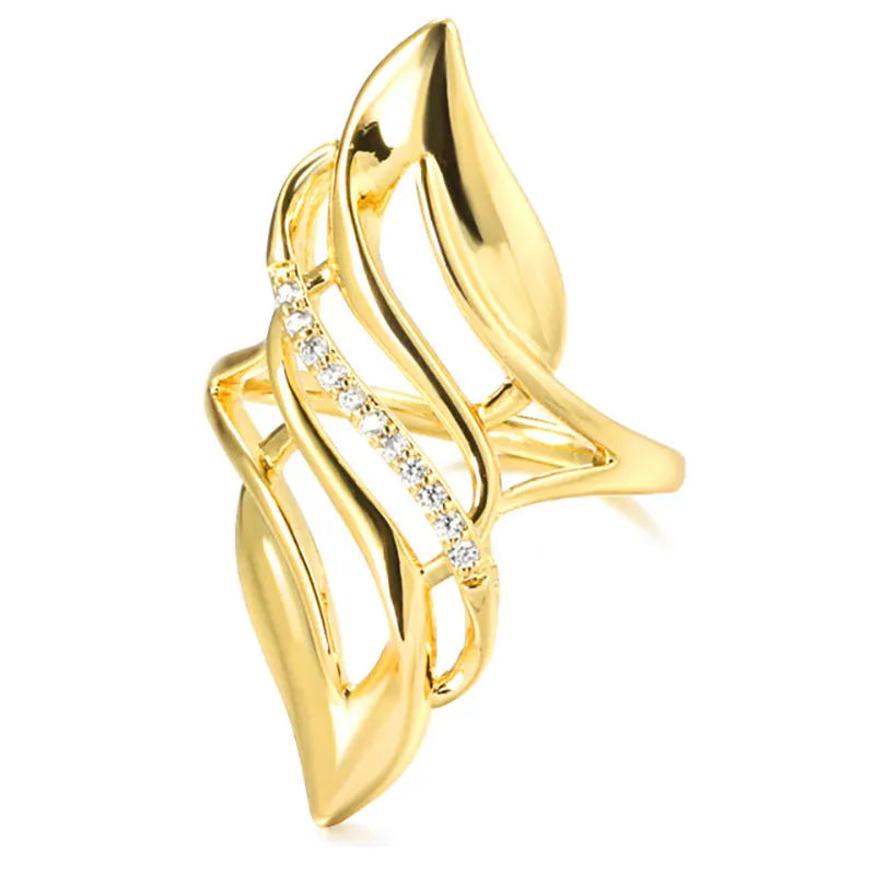 Women's exaggerated curve ring in Q611 gold colour with zircon treatment on copper