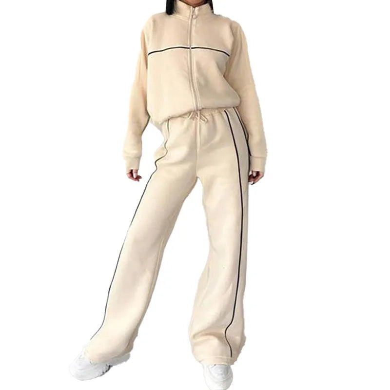 Casual polyester suit set showing a long sleeve mock neck hoodie and striped trousers on a model.
