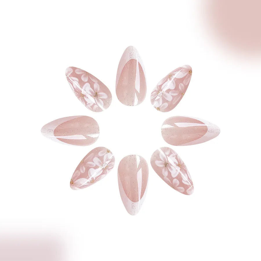 Short almond French manicure artificial nails with glitter and flower patterns in colour C625.