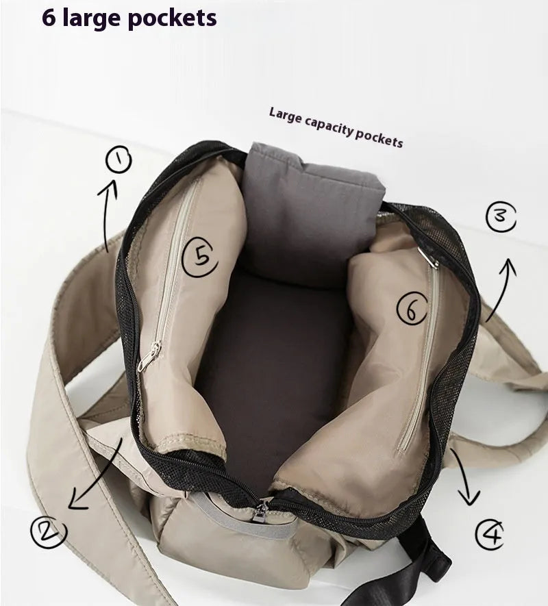 Apricot coloured cloth pet handbag carrier for cats or small dogs.
