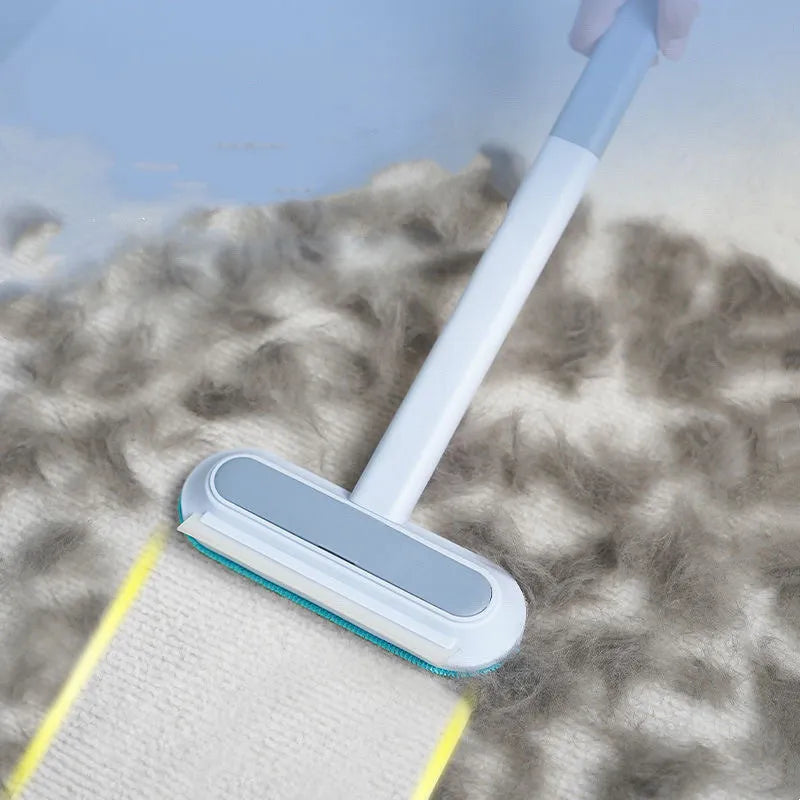 Multifunctional plastic cleaning brush with soft flannel head and extension handle for pet hair and dust.