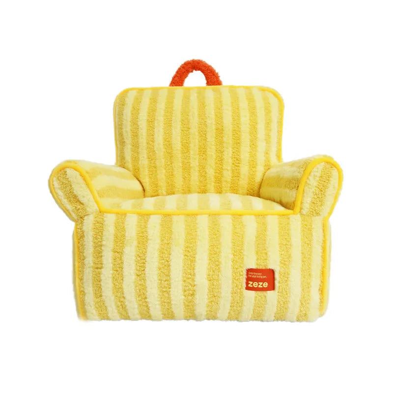 Striped orange soft velvet dog bed with a removable washable cover on a wooden floor.