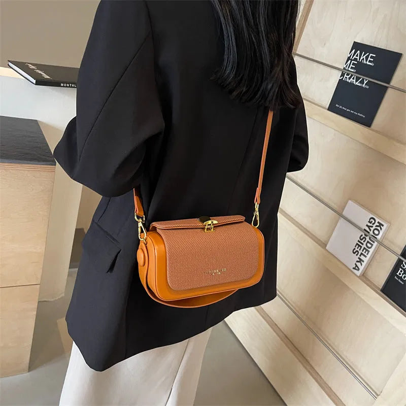 Women's PU leather messenger bag in horizontal square design with contrast stitching