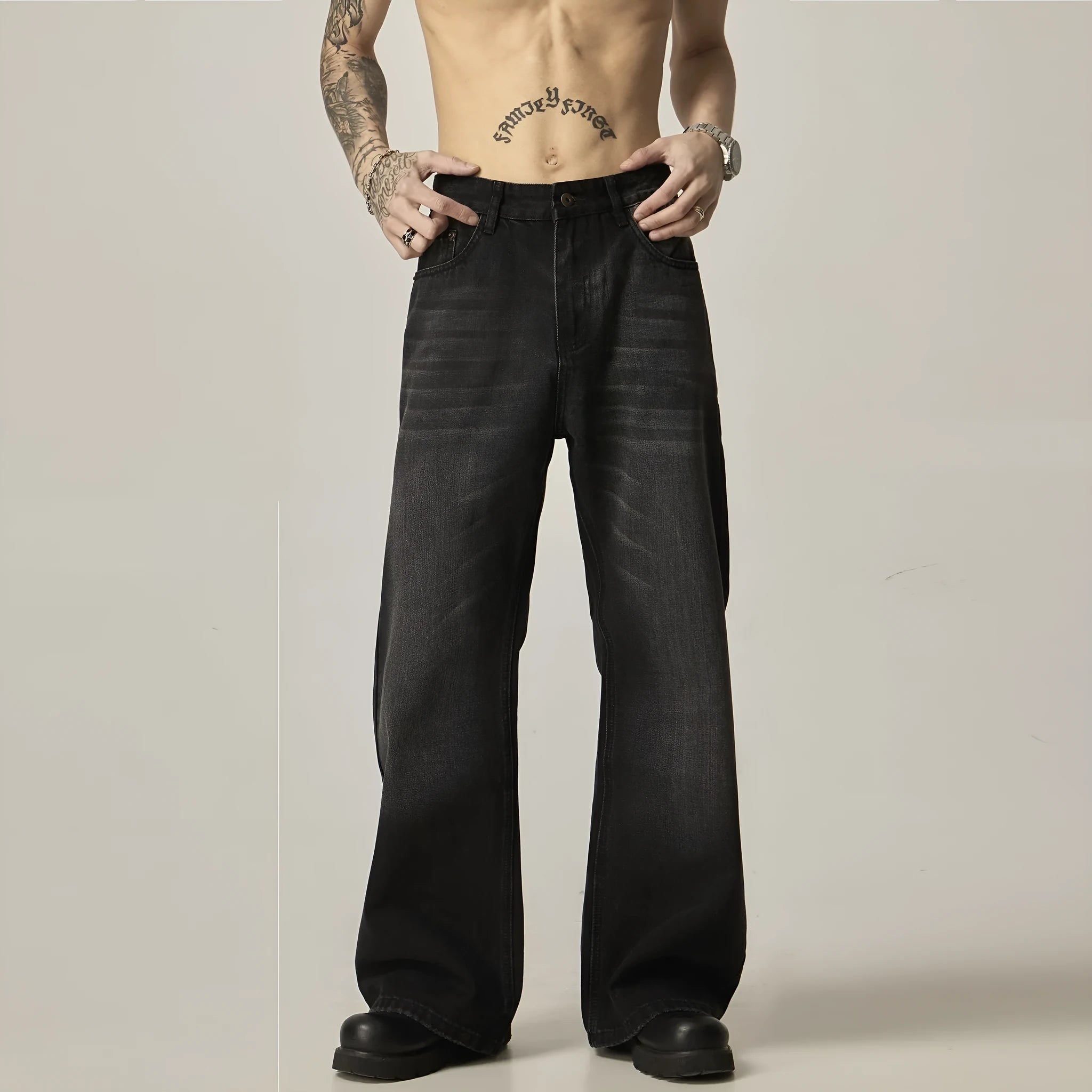 Black loose straight leg jeans with retro styling and zipper fly closure