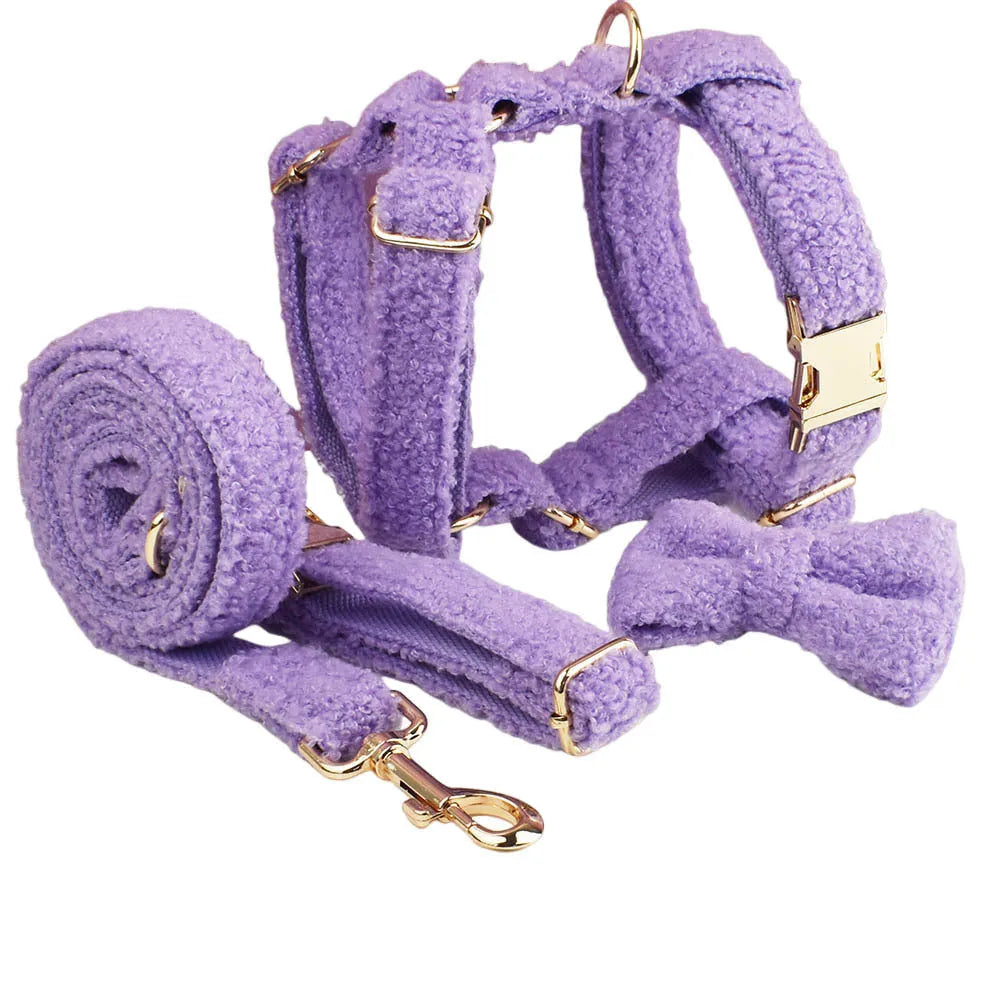 Four-piece dog clothing set showing collar, leash, vest and bow tie for small pets