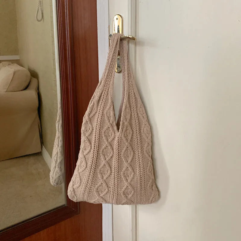 Retro hollow-knit women's shoulder tote bag in a solid colour showing double straps and textured polyester yarn construction.
