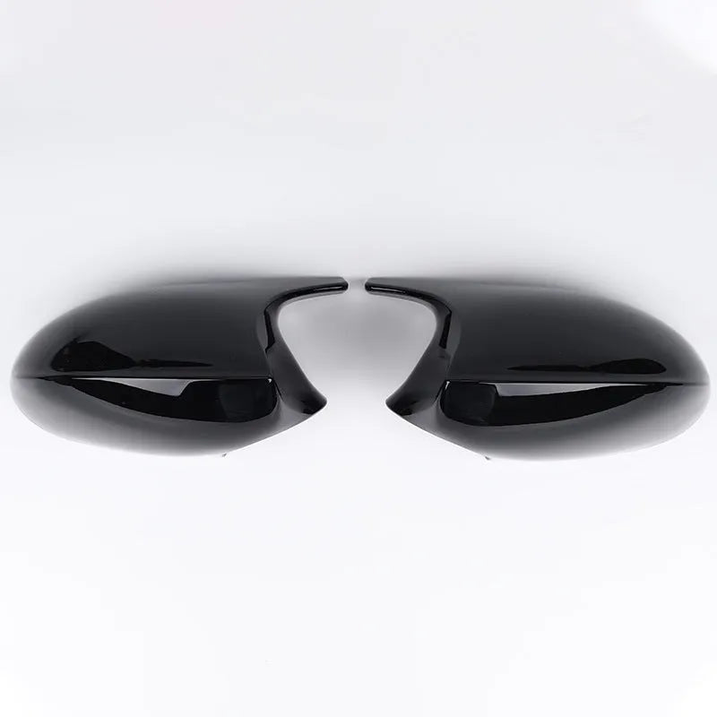 Pair of black ABS plastic rearview mirror shells for BMW 3 Series E90 car.