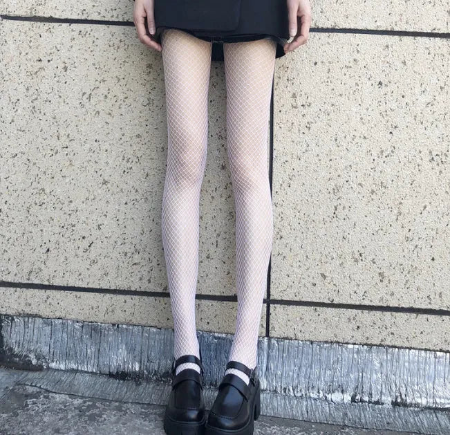 Women's mesh pattern pantyhose in black and white with large, medium, and small net designs
