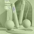 ABS plastic skipping rope with bearing mechanism in a choice of colours including black, green, blue, pink and purple.