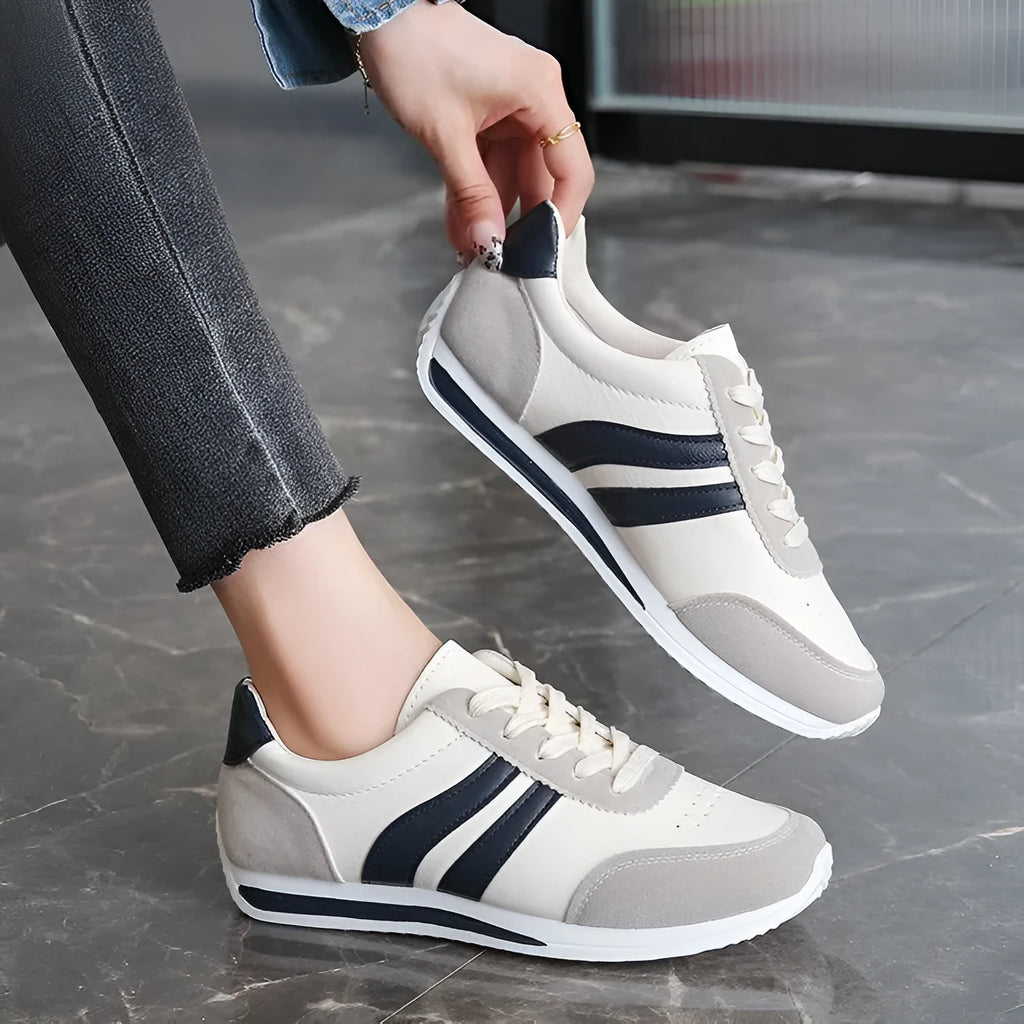 Red and blue low top lace-up leisure sneaker with PU mesh upper and rubber sole.