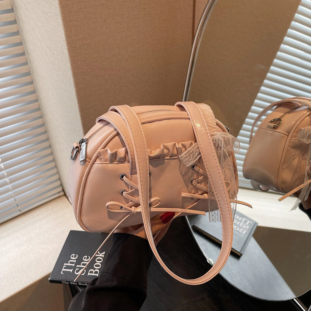 Women's casual PU shoulder handbag with bandage bow design in milky white colour showing sewing thread details