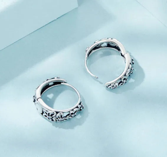 Retro hollow butterfly sterling silver 925 earrings with zircon accents, 14mm tall.