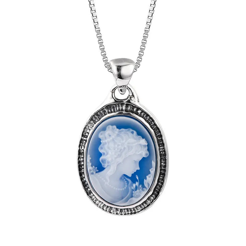 S925 sterling silver pendant with embossed blue and white agate oval portrait on white background