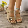 Light brown women's Roman sandals with a Velcro strap and rounded toe on a rubber sole.