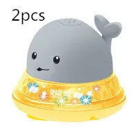 Electric whale-shaped bath spray toy with water-activated automatic spray, LED lights, and floating capability
