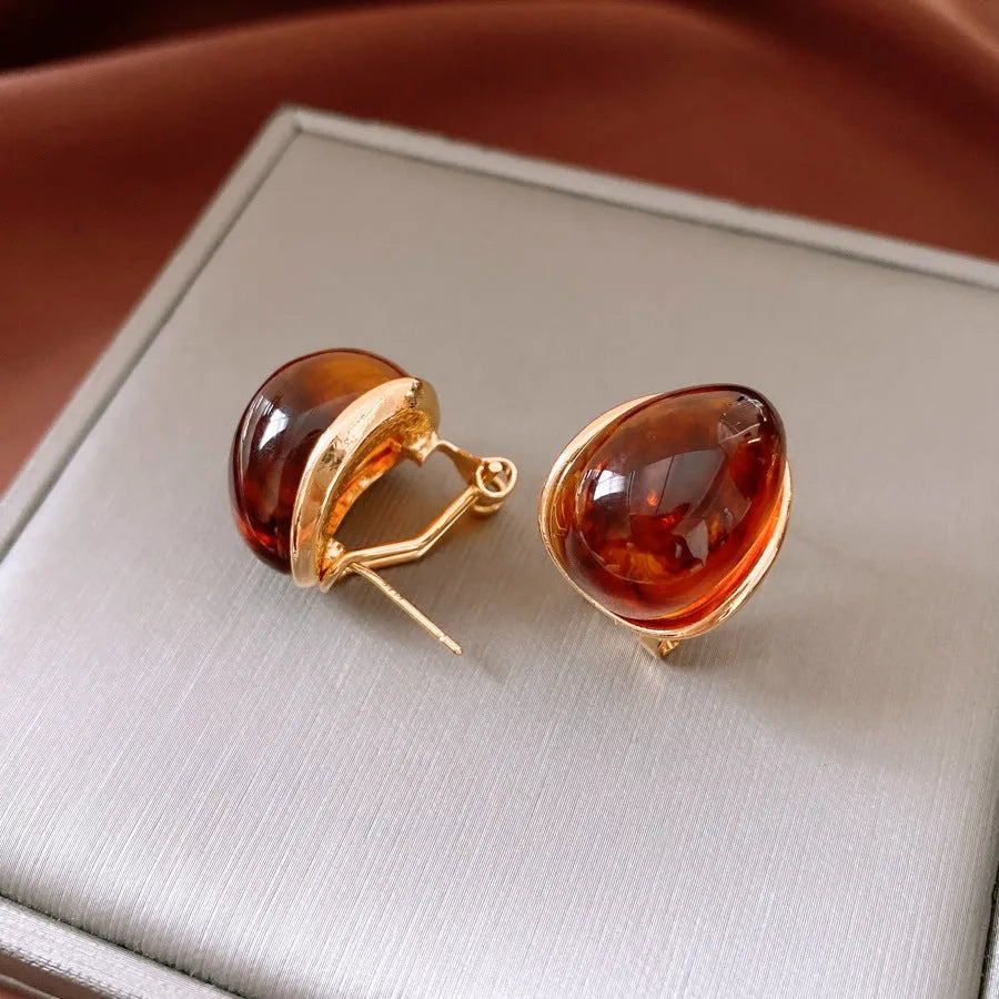 Amber water drop ear studs and ear clips in coffee colour with silver needles and electroplated resin drop shape