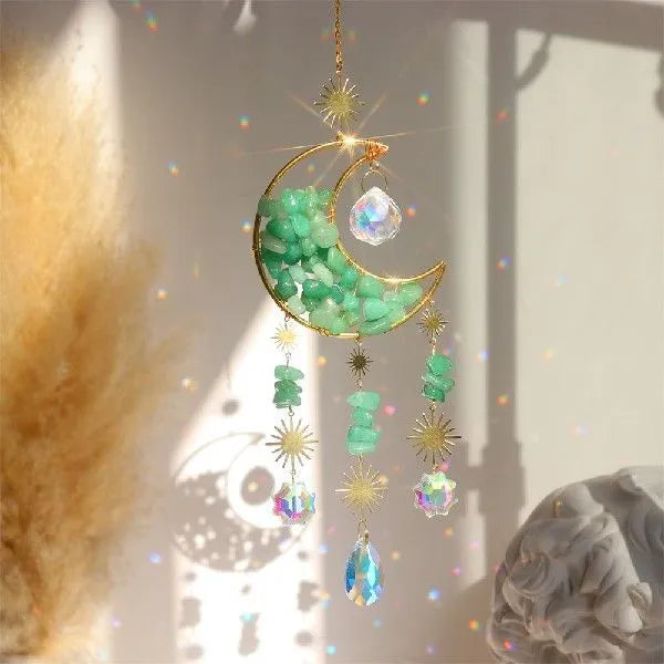 K9 crystal moon car pendant hanging on a metal chain, shown in a blue colour option.