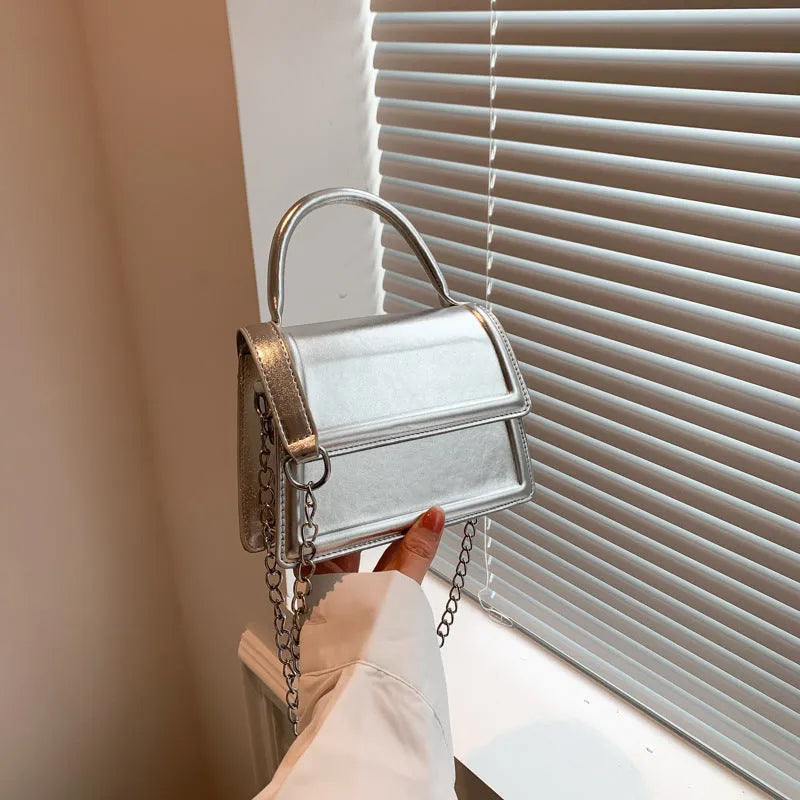 Women's retro crossbody bag in six colour options showing horizontal square shape and shoulder strap