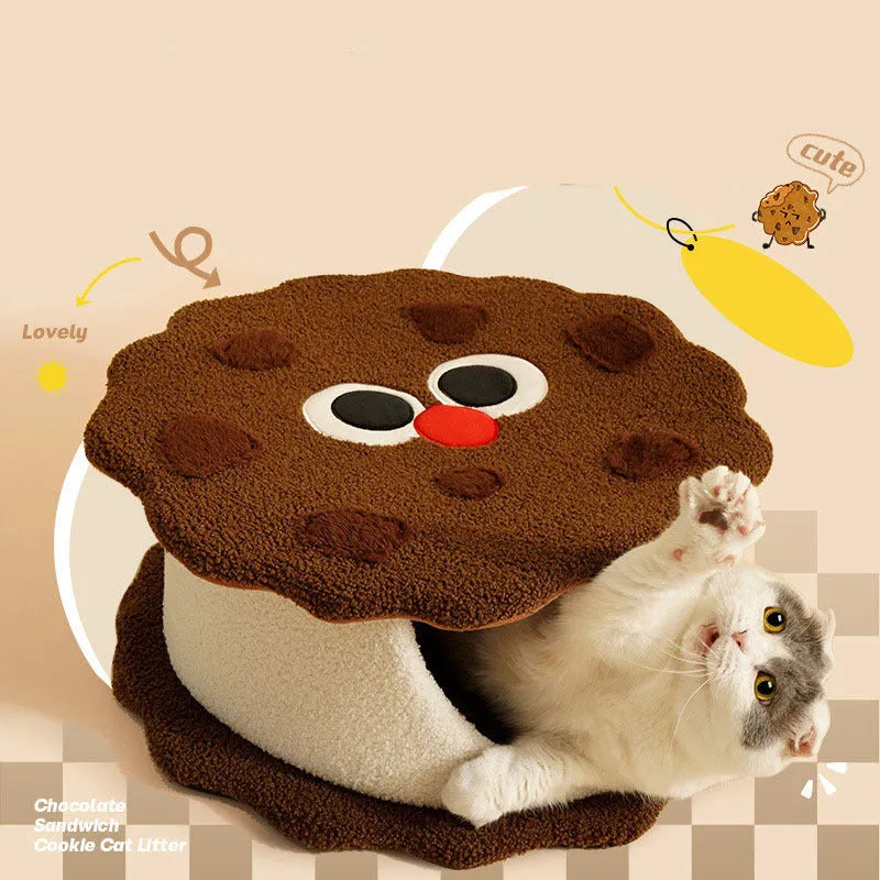 Khaki-coloured closed cat house with a nest shape resembling a sandwich cookie.