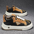 Men's beige and black low-top casual sneakers with elastic band fastening and mesh lining.