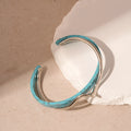 Geometry pattern twisted open-ended bracelet in 22 Silver Blue alloy with electroplated finish