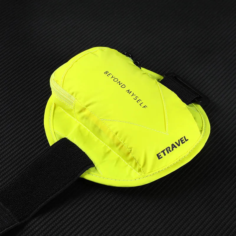 Black reflective running arm bag with adjustable strap, holding a mobile phone, shown on a runner's arm.