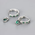 Women's zircon heart drop earrings with coloured stone in gold or white gold colour setting.