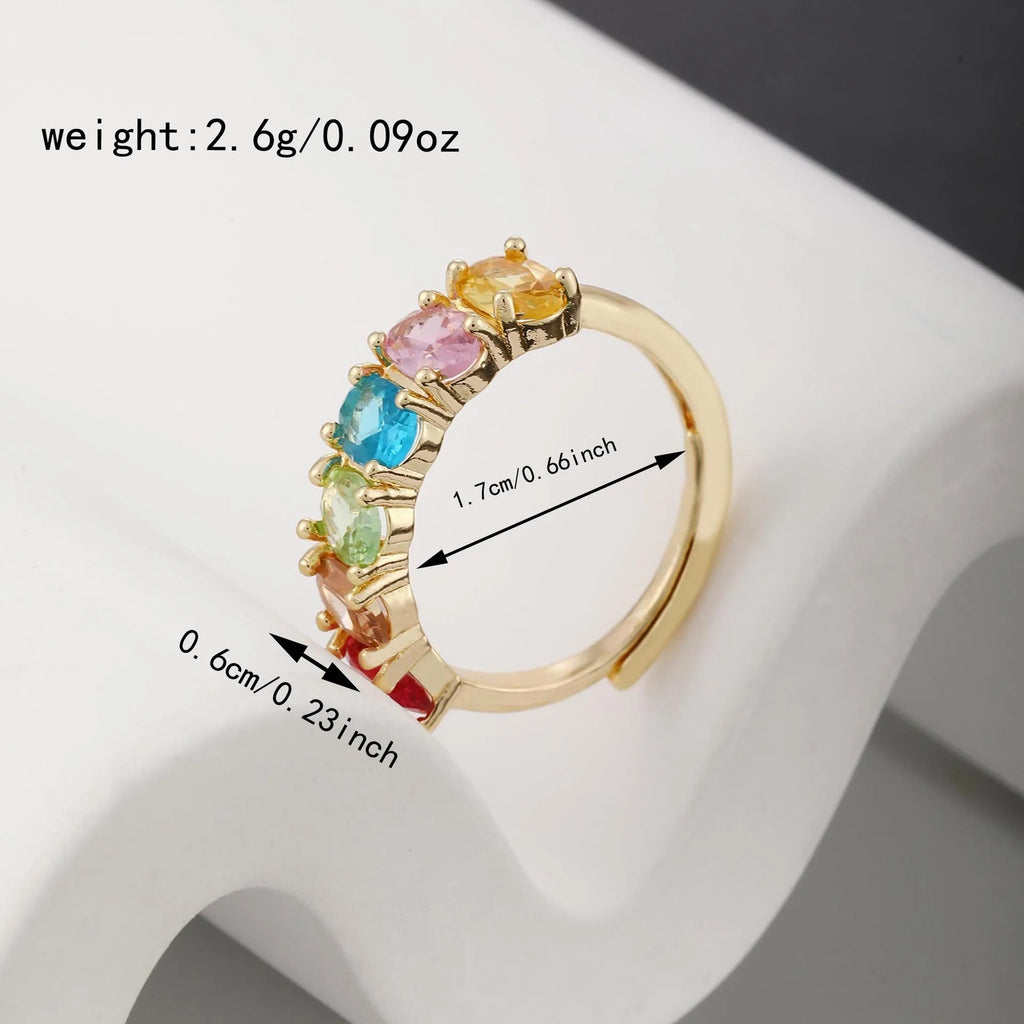 Gold electroplated adjustable ring for women with a zircon detail on a simple retro-style band.