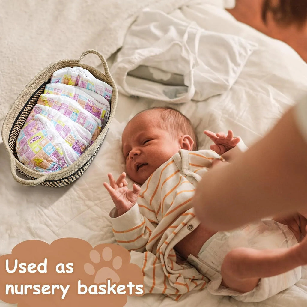 Small light beige woven cotton rope storage basket with wooden handles for organisation