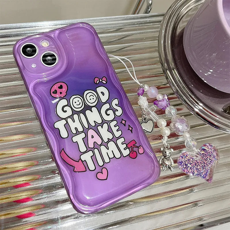 Purple graffiti love design iPhone 14 phone case with an attached silver chain bracelet.