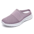 Women's breathable mesh casual shoes in black with a round toe, flat heel, and hollow out design detail.