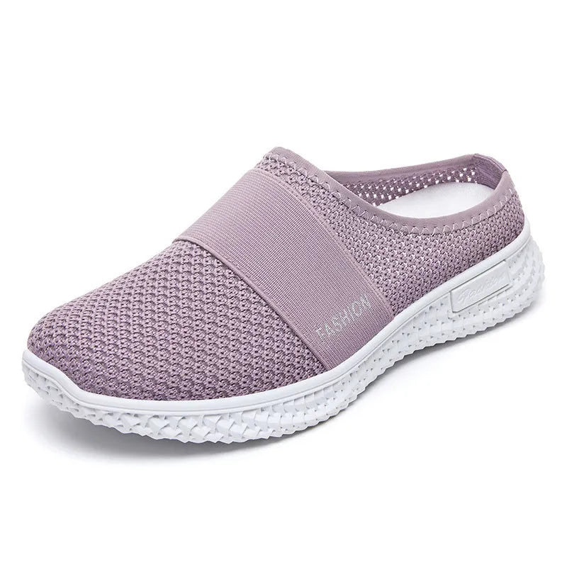 Women's breathable mesh casual shoes in black with a round toe, flat heel, and hollow out design detail.