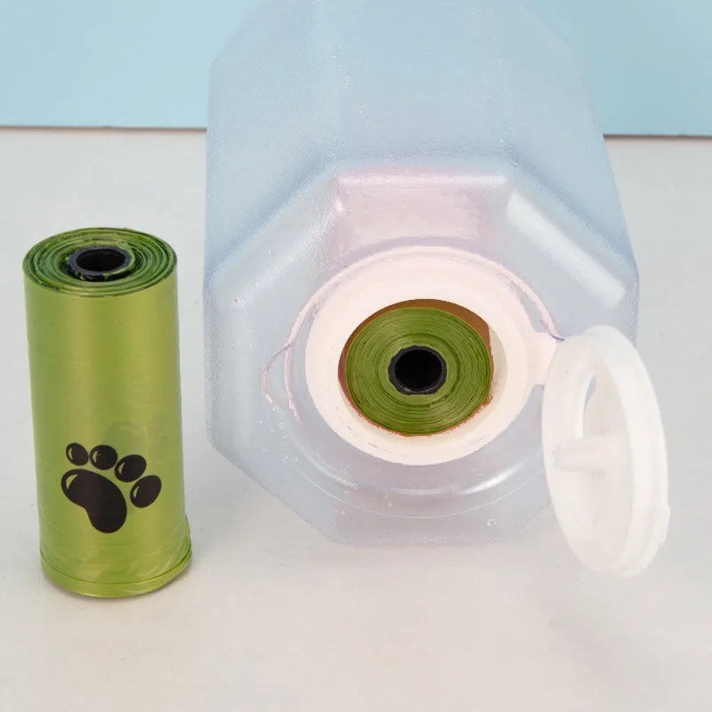 Turquoise portable 3-in-1 dog water bottle with food feeder and built-in poop bag dispenser on a walk
