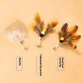 Three steel-wire flying insect-shaped cat toy replacement heads on a white background.